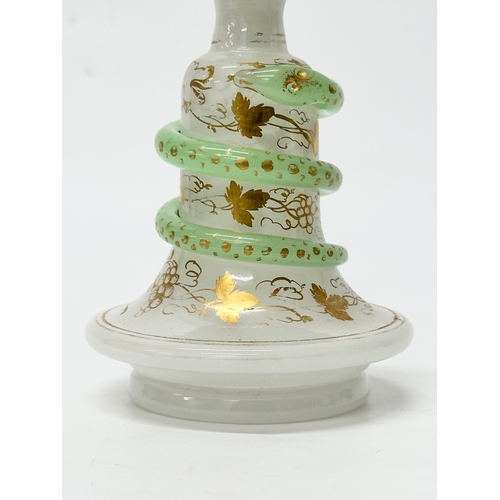 4 - Baccarat. A 19th Century French opaline glass “Snake Trail” perfume bottle. C.1860. With gilt flower... 