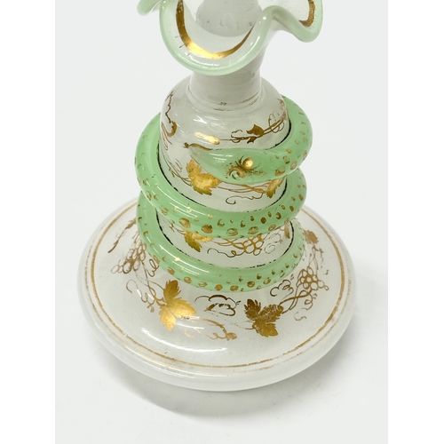 4 - Baccarat. A 19th Century French opaline glass “Snake Trail” perfume bottle. C.1860. With gilt flower... 