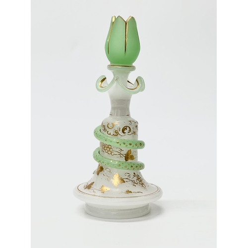 4 - Baccarat. A 19th Century French opaline glass “Snake Trail” perfume bottle. C.1860. With gilt flower... 