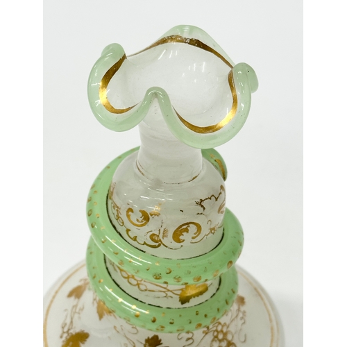 4 - Baccarat. A 19th Century French opaline glass “Snake Trail” perfume bottle. C.1860. With gilt flower... 