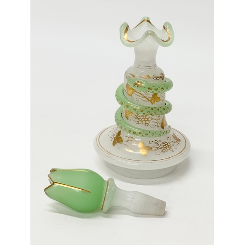 4 - Baccarat. A 19th Century French opaline glass “Snake Trail” perfume bottle. C.1860. With gilt flower... 