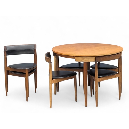 Hans Olsen for Frem Rojle. A Danish Mid Century teak "Roundette" table and 6 chairs. 157x106x74.5cm (3)