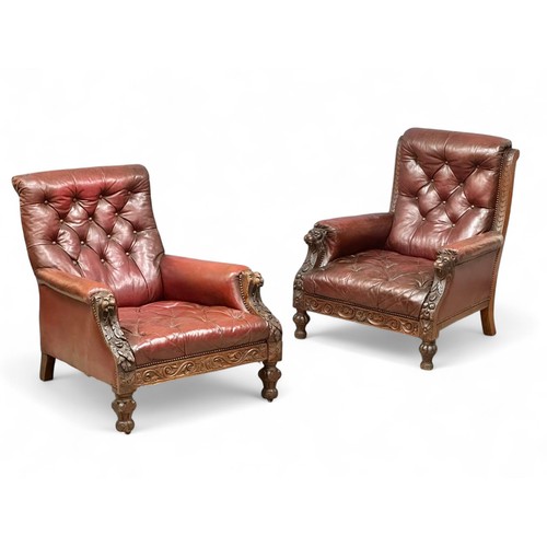 James Shoolbred & Co. A pair of quality 19th Century oak framed armchairs. With original deep button back leather. C.1870. Both stamped. (1)
