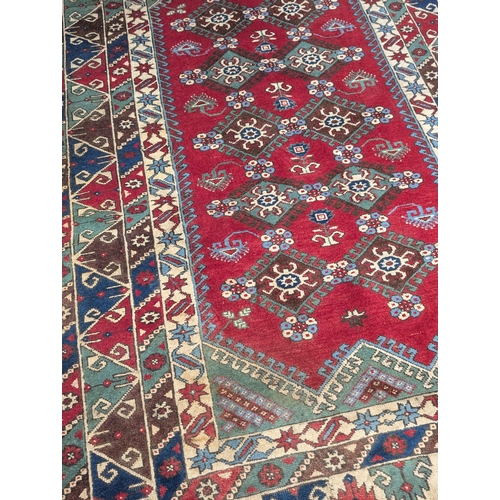 A large Middle Eastern style rug, 273cm x 178cm (5)