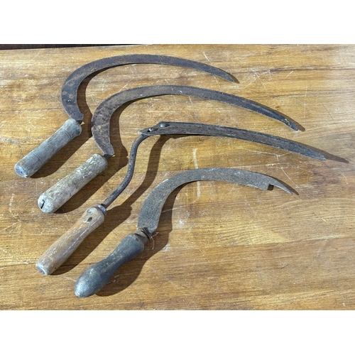 1 - Four vintage sickles.