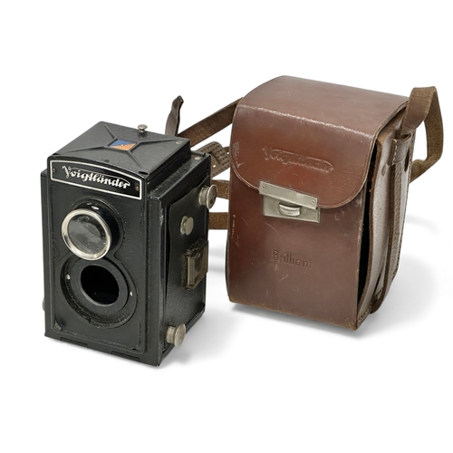 A collection of cameras. Early-Mid 20th Century. Aka Relle, Voigtlander ...