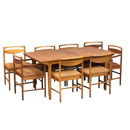 A McIntosh teak double extending dining table and eight chairs. Designed by Tom Robertson. C.1960. Extended 236x92x74cm. Closed 160x92x74cm