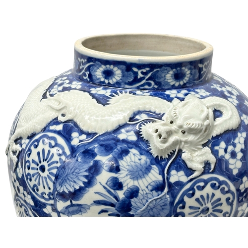 59 - An extra large Japanese Arita pot. Meiji Period (1868-1912) Late 19th Century. Two moulded relief dr... 