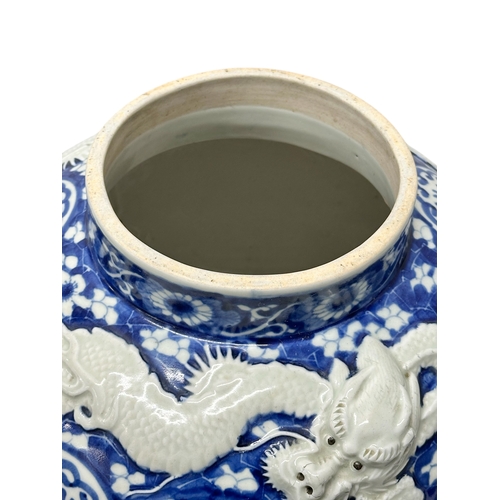 59 - An extra large Japanese Arita pot. Meiji Period (1868-1912) Late 19th Century. Two moulded relief dr... 