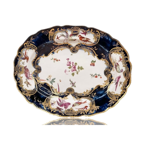 98 - Chelsea, C.1760. A Mazarine Ground Platter. 18th Century. Gold Anchor Mark. A central white reserve ... 