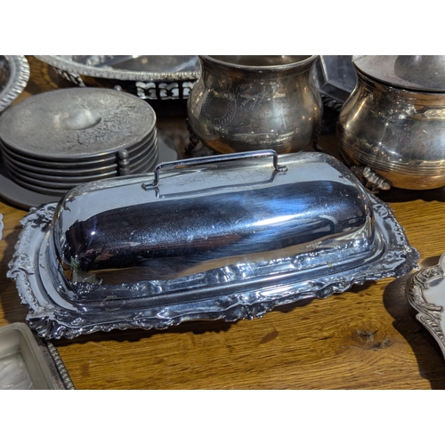 263 - Quantity of EPNS serving trays, coffee and tea pot, butter dishes etc