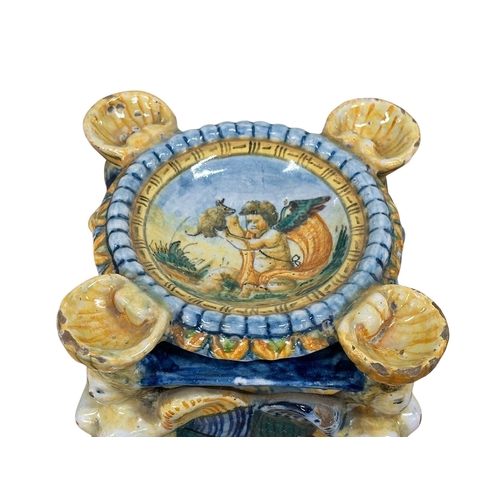 114 - Ariano Irpino, Late 16/Early 17th Century. An Italian Majolica Salt Cellar. 11.5x11.5x16.5cm.