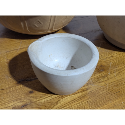 15 - Large early 20th century mortars with a vintage baking bowl