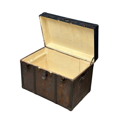 46 - A Late Victorian leather bound steamers trunk. 77x49x54cm. (4)