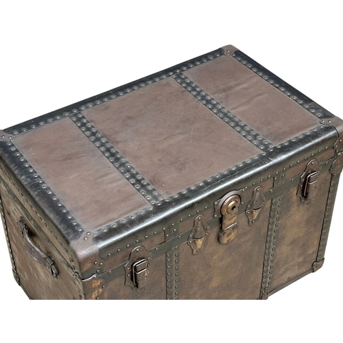 46 - A Late Victorian leather bound steamers trunk. 77x49x54cm. (4)