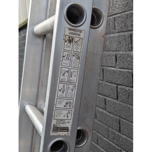 37 - Large extending alloy ladders. 341cm unextended