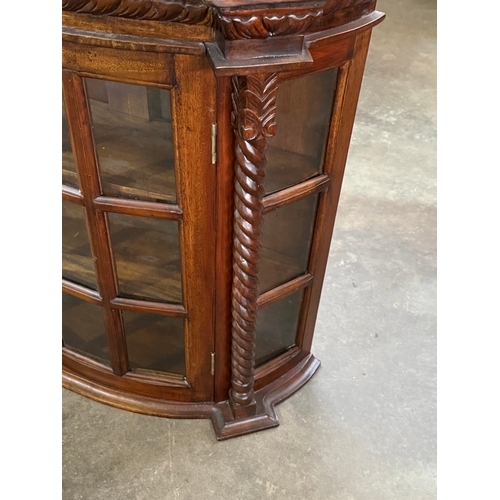 225 - A mahogany wall hanging cabinet. 75x25.5x71cm.