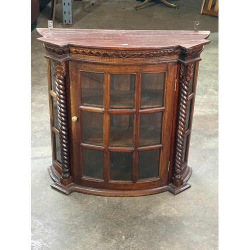 225 - A mahogany wall hanging cabinet. 75x25.5x71cm.