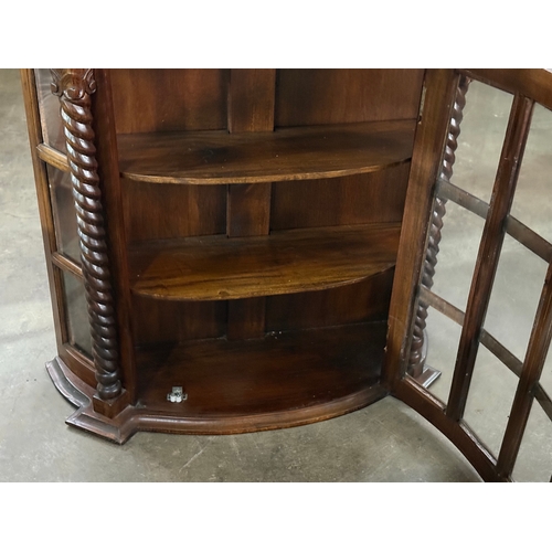 225 - A mahogany wall hanging cabinet. 75x25.5x71cm.