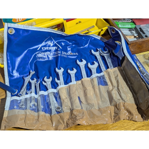 231 - Quantity of tools including 2 tool boxes, electric sander, Everest spanners set, drill bits etc