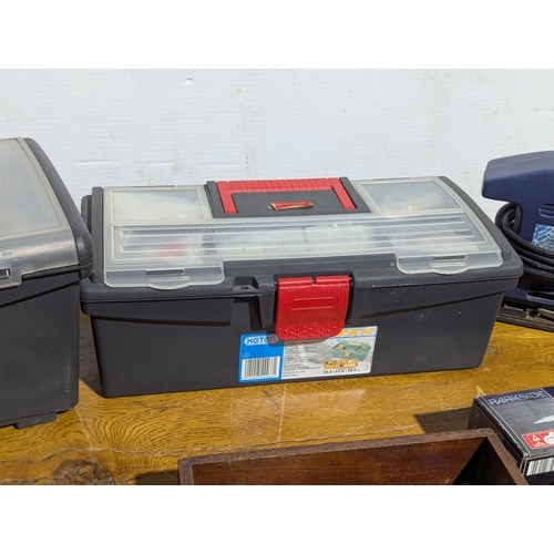231 - Quantity of tools including 2 tool boxes, electric sander, Everest spanners set, drill bits etc