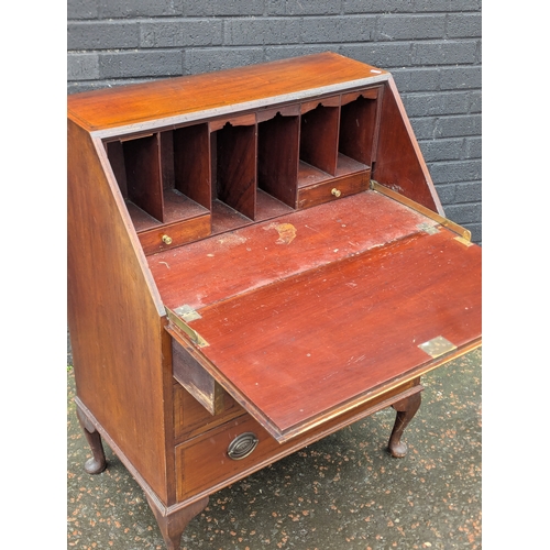 235 - A vintage inlaid bureau.