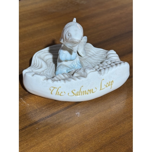 236 - Belleek Pottery The Salmon Leap. 14x13x9.5cm.