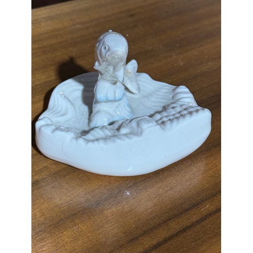 236 - Belleek Pottery The Salmon Leap. 14x13x9.5cm.