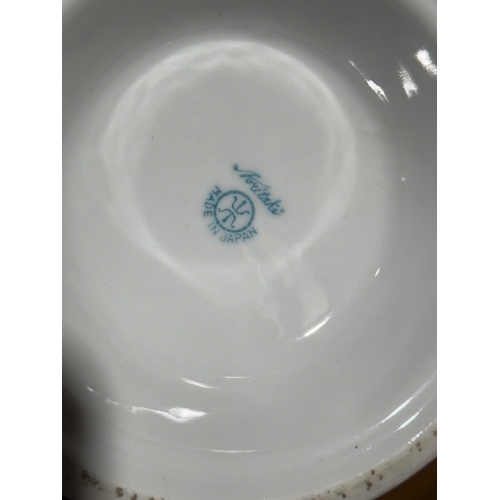 237 - A pair of Noritake pottery vases. 30cm.