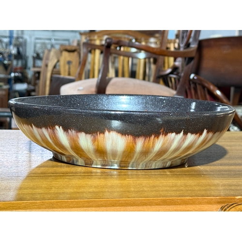 239 - A mid century glazed stoneware bowl. Unmarked.  30x7.5cm