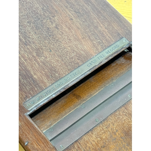 24 - An Edwardian cash register. 28x50x18.5cm.