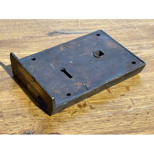 40 - A William McGeoch brass rim lock. 15.5x10cm.