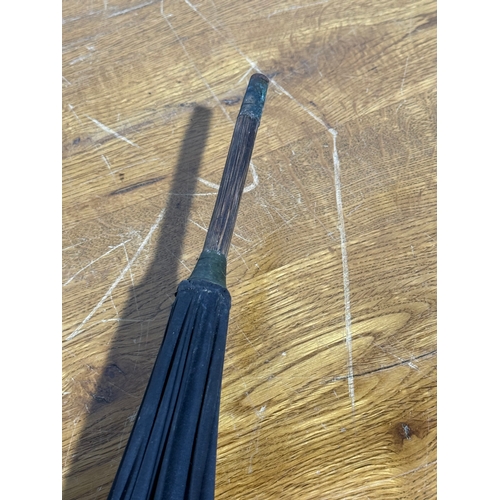 35 - A late Victorian/Edwardian umbrella with 18ct gold plated and mother of pearl handle.