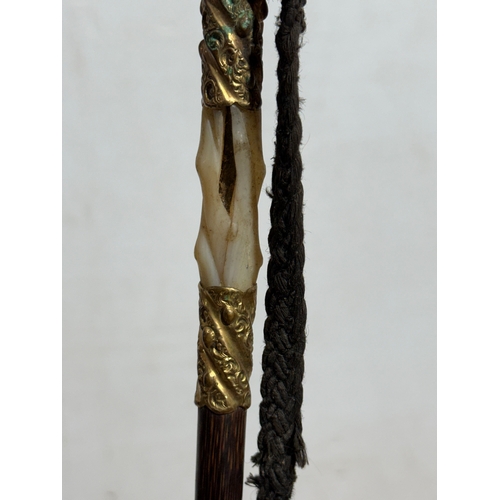 35 - A late Victorian/Edwardian umbrella with 18ct gold plated and mother of pearl handle.
