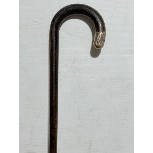 246 - A silver mounted walking stick. 87cm.