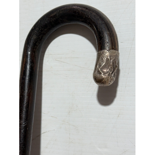 246 - A silver mounted walking stick. 87cm.