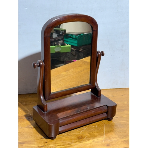 254 - A Victorian dressing mirror. 39.5x19x54cm