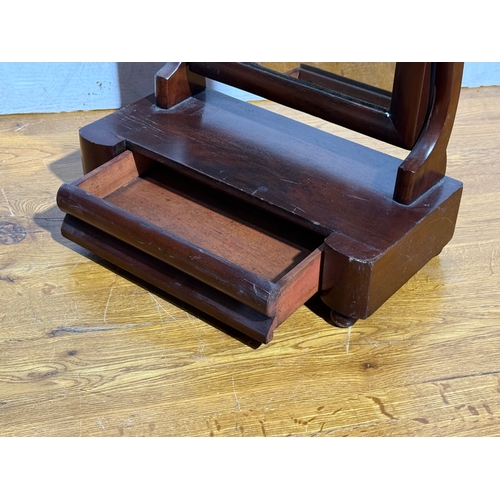 254 - A Victorian dressing mirror. 39.5x19x54cm