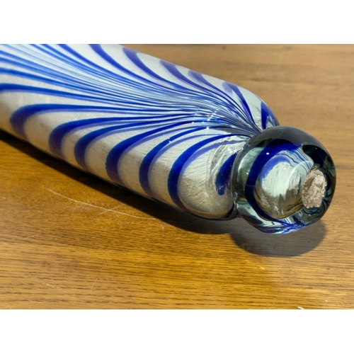 33 - A late 19th century Nailsea Glass rolling pin. 43cm.