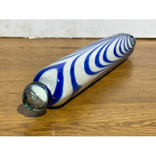 33 - A late 19th century Nailsea Glass rolling pin. 43cm.