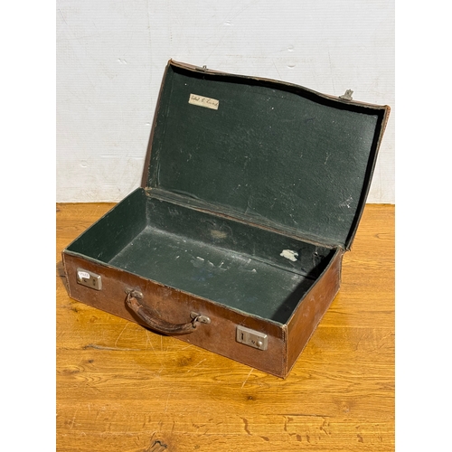 259 - Three vintage leather travelling cases. Largest 67x40x21cm.