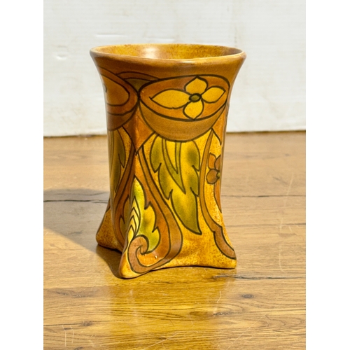 260 - A Flaxman Ware vase by Wadeheath. 11x15cm.