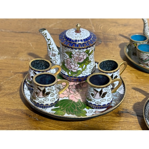 28 - Three vintage Chinese miniature cloisonné tea sets.