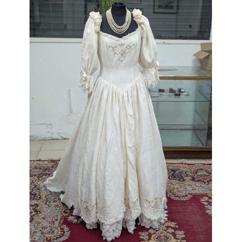 37A - A vintage wedding dress. Stand not included.