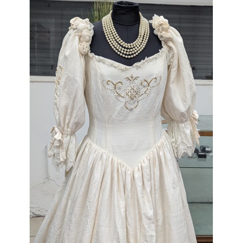 37A - A vintage wedding dress. Stand not included.