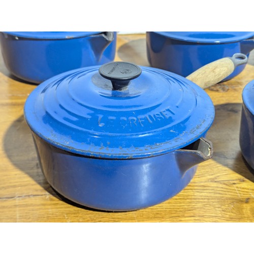 9A - A collection of Le Creuset pots and pans