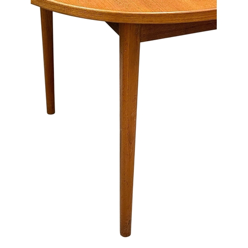 5 - Nils Jonsson, C.1960. A Danish Teak Two Leaf Extending “Ove” Dining Table and Eight Chairs. Designed... 