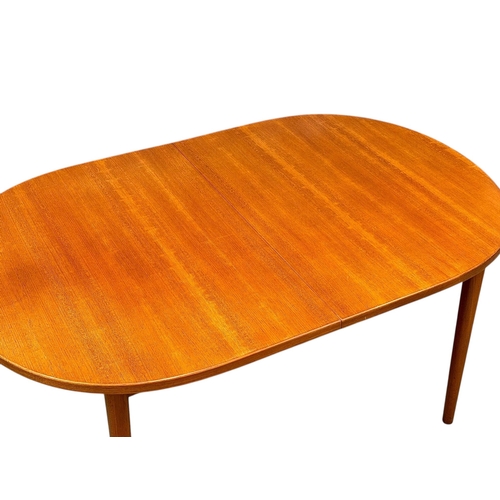 5 - Nils Jonsson, C.1960. A Danish Teak Two Leaf Extending “Ove” Dining Table and Eight Chairs. Designed... 