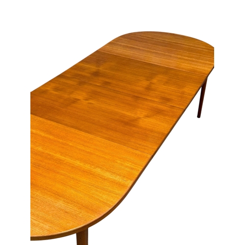 5 - Nils Jonsson, C.1960. A Danish Teak Two Leaf Extending “Ove” Dining Table and Eight Chairs. Designed... 