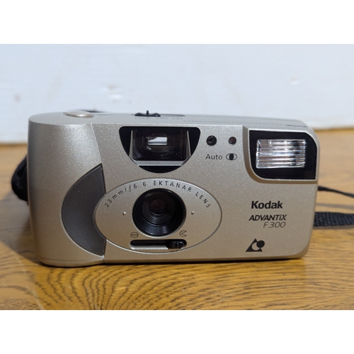 141 - Olympus trip 35 camera and a Kodak Advantix F300 camera